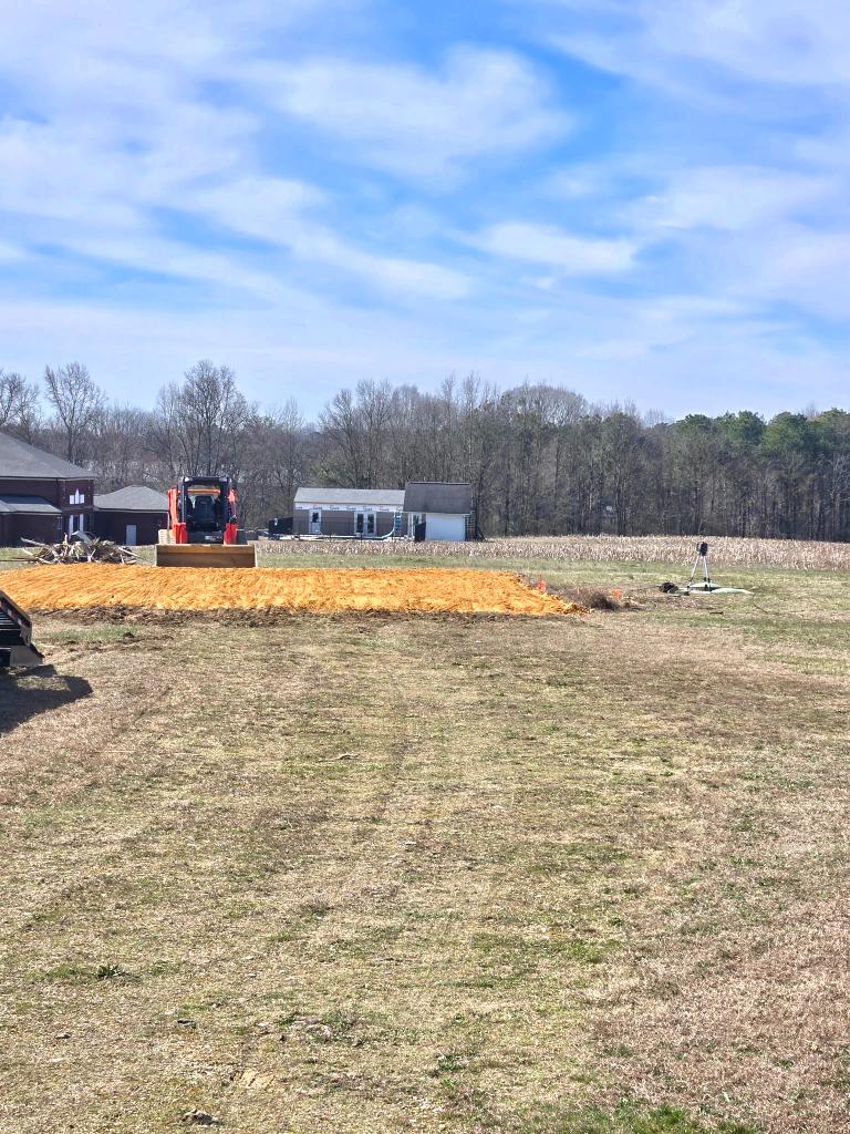 Mobile home pad preparation job site — chert and base material work